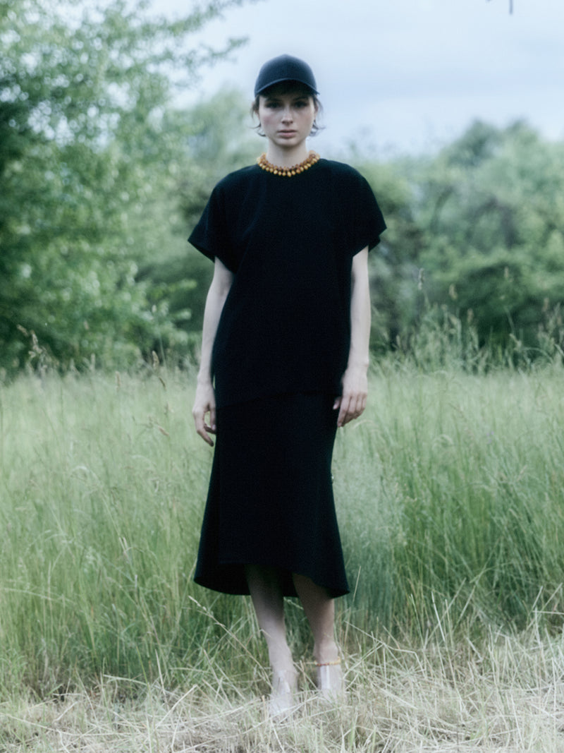 Dreams Noir wool midi skirt with flared hem