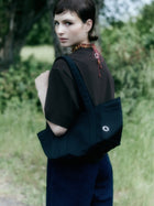 Petite Baguette cotton bag with hand-stamped logo on leather